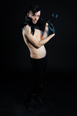 Halloween and art. An attractive guy. Black background.