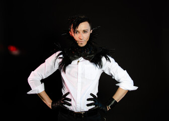 Halloween and art. An attractive guy. Black background.