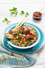lamb stew with pearl couscous and pomegranate