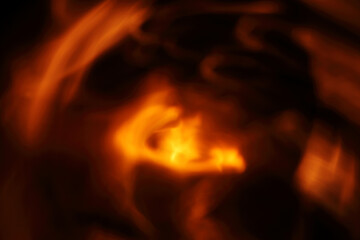 light burning and blurred on a dark background. fiery abstraction