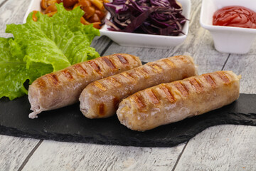 Grilled sausages served mushrooms and cabbage