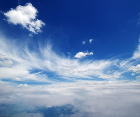 Fototapeta na wymiar White clouds airplane flying