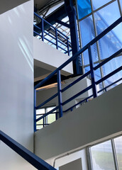 Obraz premium Flight of stairs. Stairs with blue metal railings