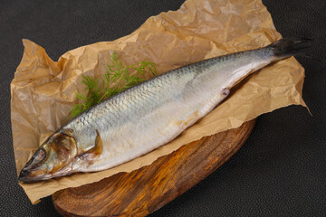 Salted herring over the wooden board