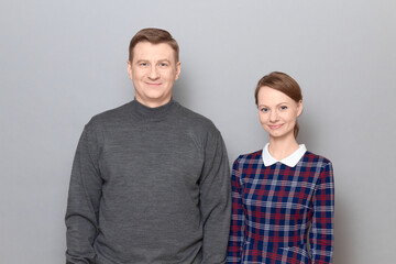 Portrait of happy joyful man and woman standing together and smiling