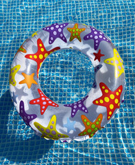Children's inflatable ring in the pool