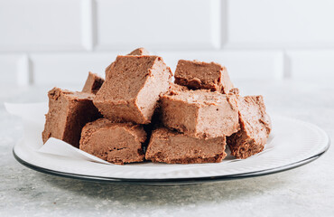 Raw vegan chocolate fudge. Healthy vegan food concept.