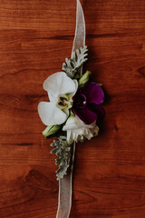 Overhead shot of a bridal corsage for bridesmaid made of orchids