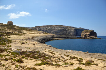 Fototapeta na wymiar Dwejra cliffs landscape on Gozo island in bright sunny day, Malta