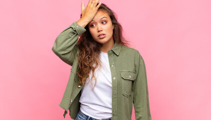  raising palm to forehead thinking oops, after making a stupid mistake or remembering, feeling dumb