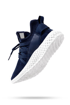 Dark Blue Sports Shoes Flying On White Background