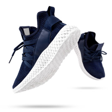 Dark Blue Sports Shoes Flying On White Background