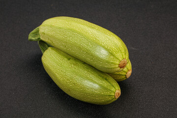Young tasty zucchini over board