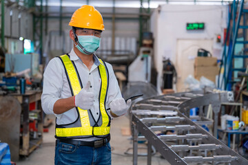 Asian man Mechanic wearing protective mask to Protect Against Covid-19,male technician worker...