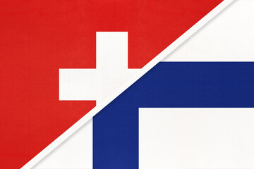 Obraz premium Switzerland and Finland, symbol of national flags from textile. Championship between two countries.