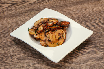 Roasted champignon with herbs and spices