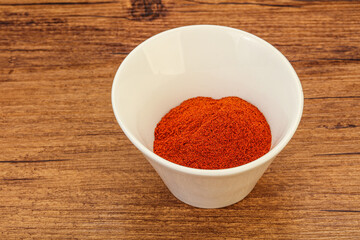 Dry paprika powder in the bowl
