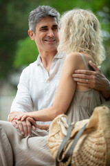 happy married couple embracing and smiling