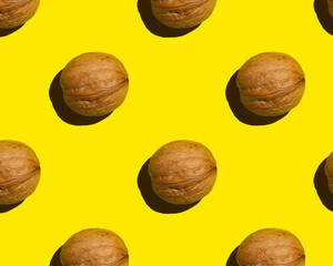 walnut on yellow background, pattern