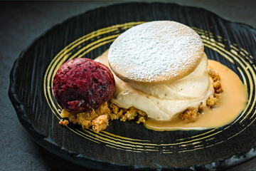 Decadent open cookie with caramel mousse and blueberry ice cream