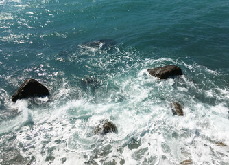 Sea waves incident on coastal boulders