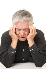 senior Japanese man suffers from headache