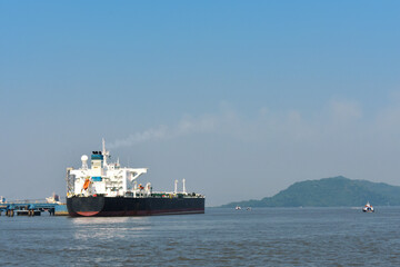 Fototapeta premium a huge merchant ship in the middle of the ocean