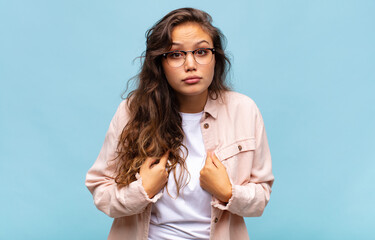  pointing to self with a confused and quizzical look, shocked and surprised to be chosen
