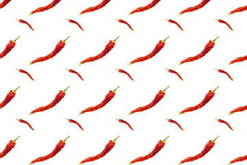 Seamless pattern of dried red chili peppers or cayenne chili peppers isolated on white background.
