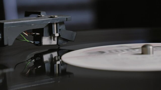 Cinemagraph vinyl record is spinning. Old retro turntable.turntable stylus on a record