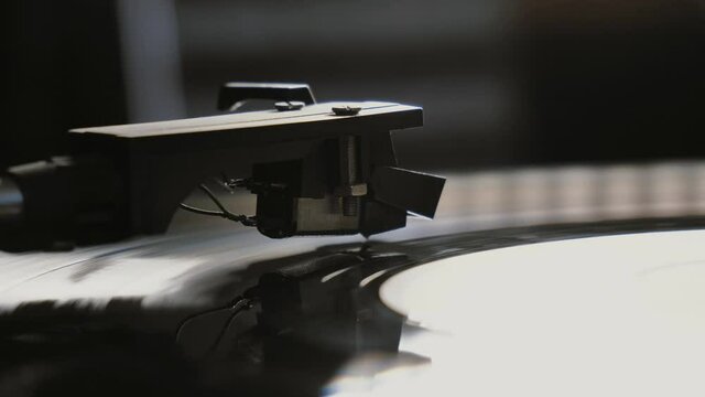 Cinemagraph vinyl record is spinning. Old retro turntable.turntable stylus on a record