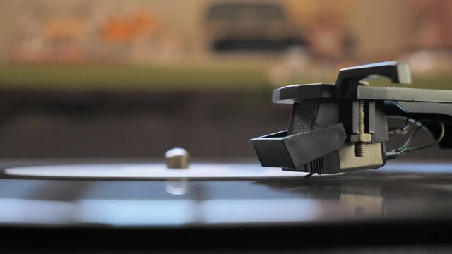 Cinemagraph vinyl record is spinning. Old retro turntable.turntable stylus on a record