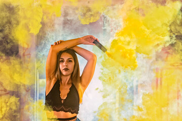 Obraz na płótnie Canvas Girl maneuvering colorful smoke grenade