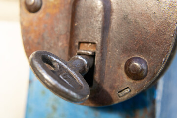 an old padlock with a key inside.