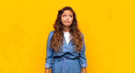  looking puzzled and confused, wondering or trying to solve a problem or thinking