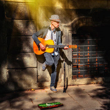 Street musician with guitar. Portrait. Music and  freedom concept.