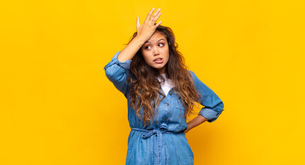  raising palm to forehead thinking oops, after making a stupid mistake or remembering, feeling dumb