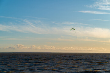 Beautiful sunset sky on the beach. Kitesurfing. Power kite. Beautiful scenery