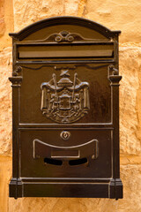 old decorated mailbox on the wall in Mdina, Malta