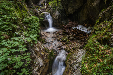 Fototapeta na wymiar steps in a clear cold waterfall