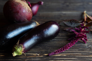 purple vegetables on black wooden boards and amaranths