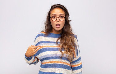  looking shocked and surprised with mouth wide open, pointing to self