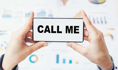 Call me noted on smartphone on financial charts background