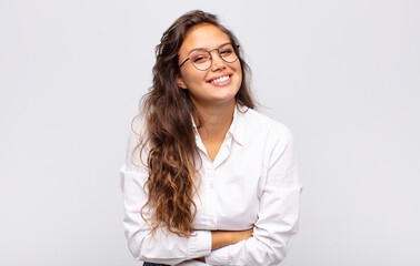  looking like a happy, proud and satisfied achiever smiling with arms crossed