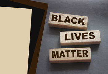 Black lives matter words on Wooden building blocks on black background. Stop racism concept