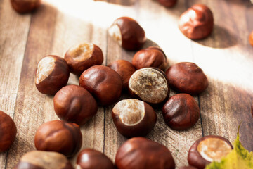
Chestnuts on the table in different dishes. And there are leaves nearby.