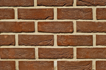 exture of brick wall. new brickwork. Samples of wall or fence are presented at exhibitions. Brown brick close up.