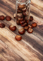 
Chestnuts on the table in different dishes. And there are leaves nearby.
