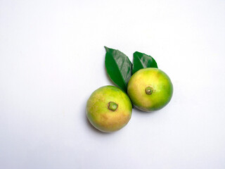green lemon isolated on white