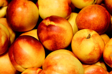 Fototapeta na wymiar Pile of fresh peaches - background